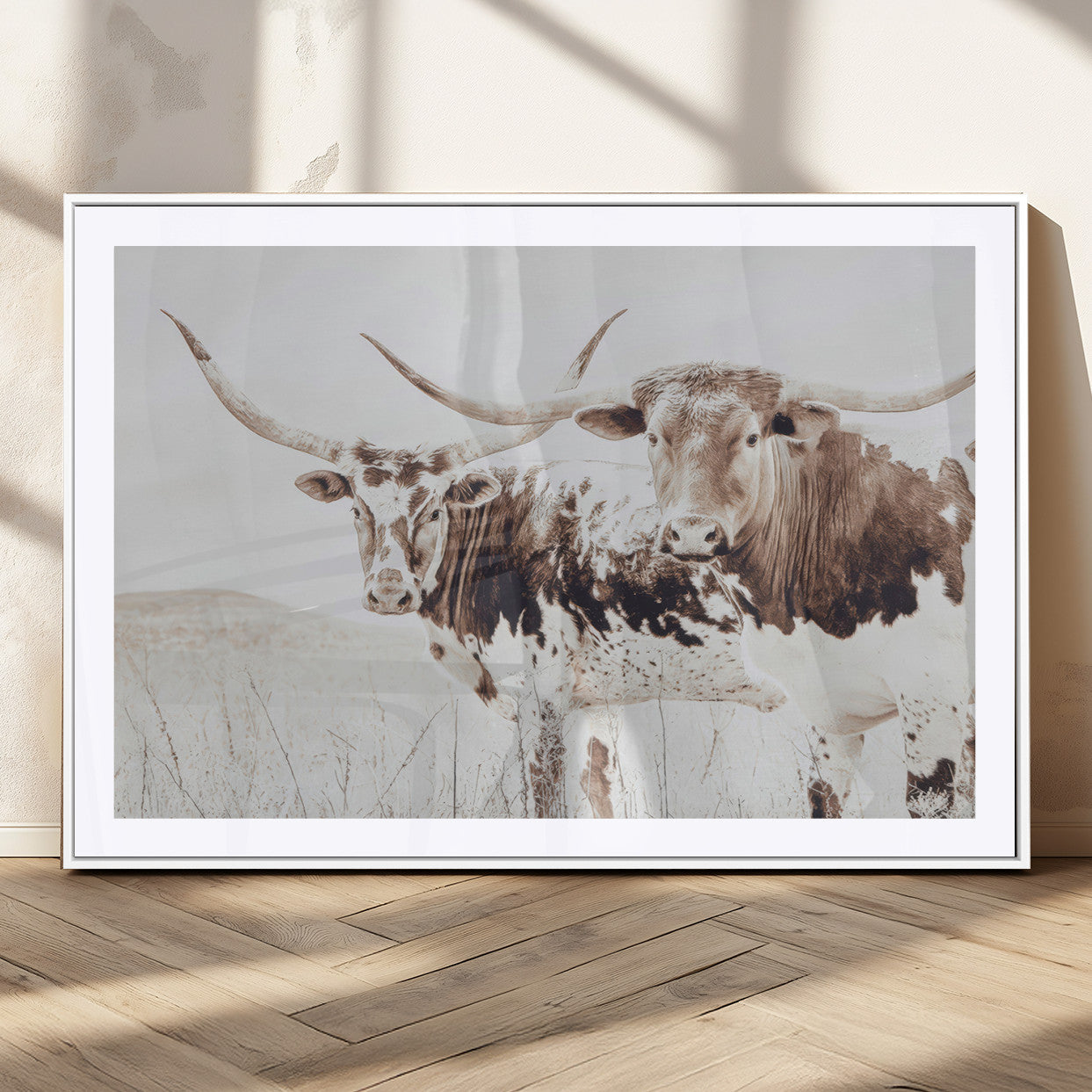 Two longhorn cows standing in a sepia-toned pasture with soft light, ideal for rustic or farmhouse-themed neutral wall decor.