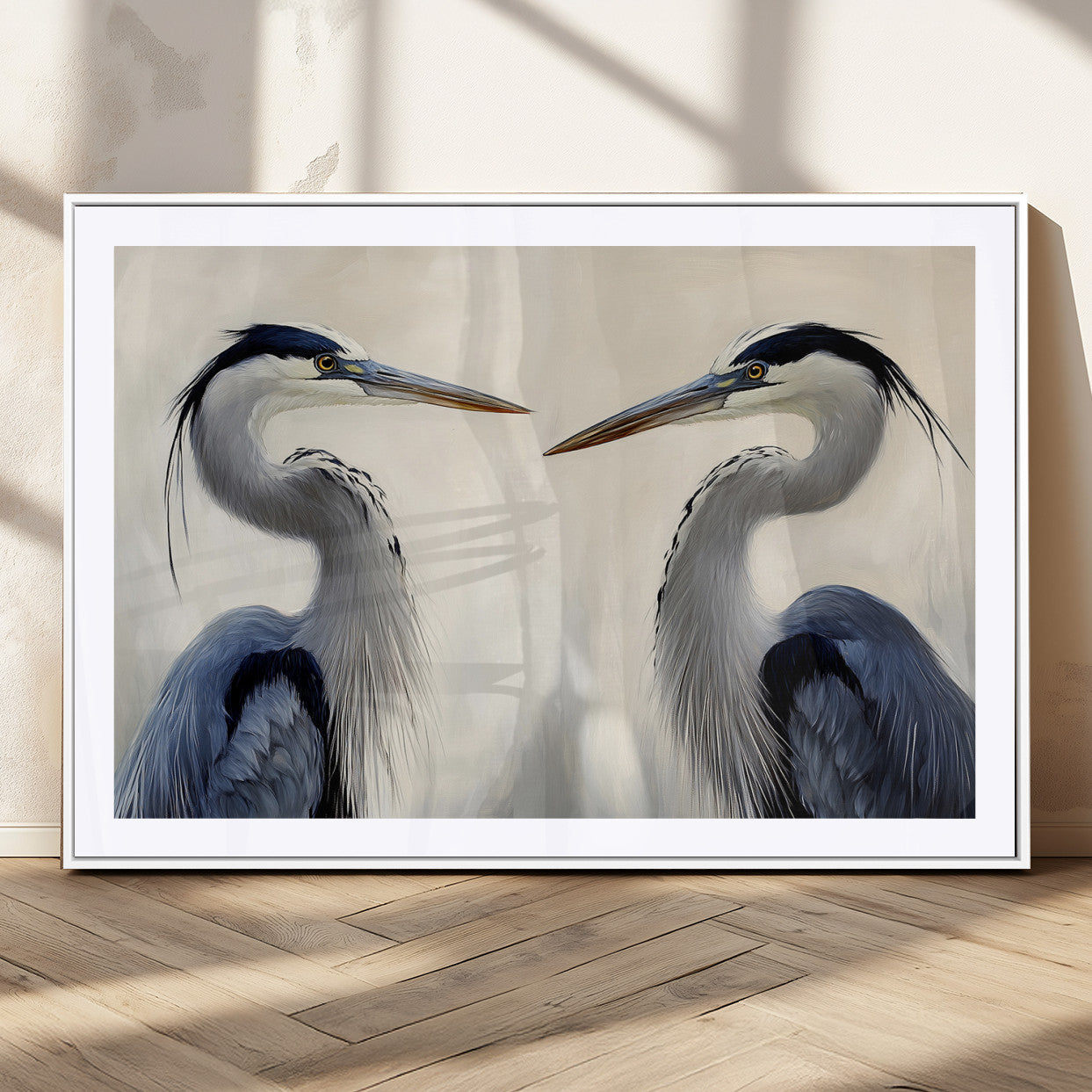 Two blue herons facing each other on a soft neutral background, ideal for coastal, tranquil, or nature-inspired minimalist interiors.