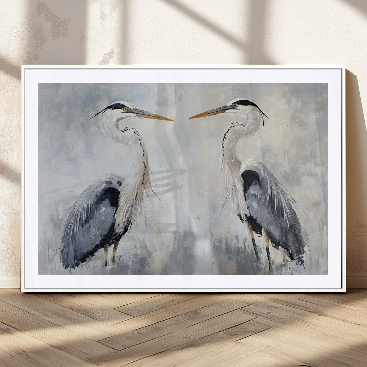 Two herons facing each other on a soft-toned background with blue-grey feathers, perfect for tranquil, coastal or nature-themed interiors.