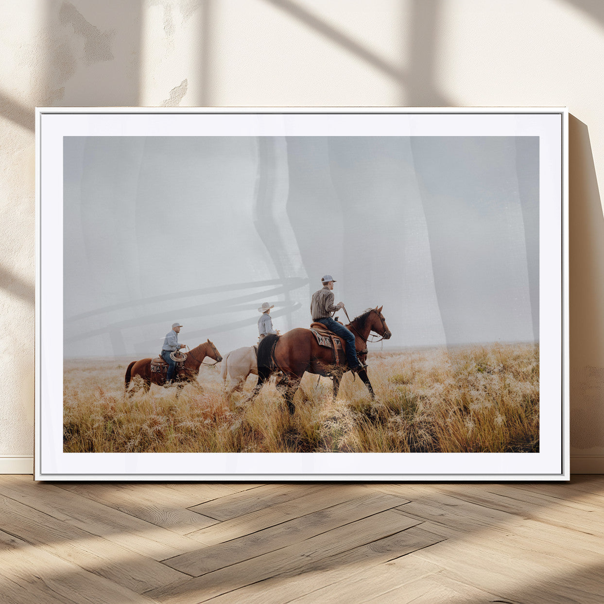 Three cowboys riding horses through a foggy prairie landscape, dressed in Western attire, evoking a rustic and adventurous Wild West aesthetic.