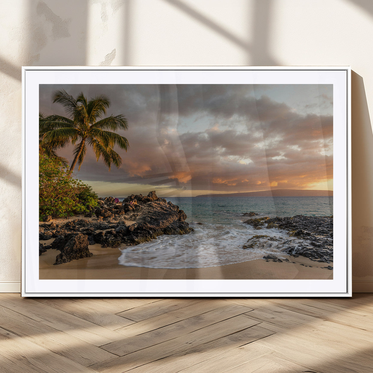 Golden sunset over a tropical beach with palm trees, rocky shoreline, and gentle ocean waves, perfect for coastal and island-inspired decor.