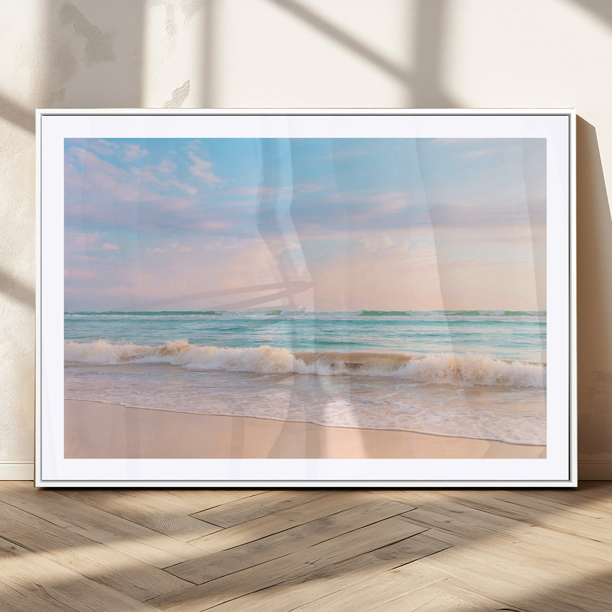 A peaceful beach scene with soft pastel skies, gentle waves washing up on the sandy shore, creating a calm and serene ocean view.