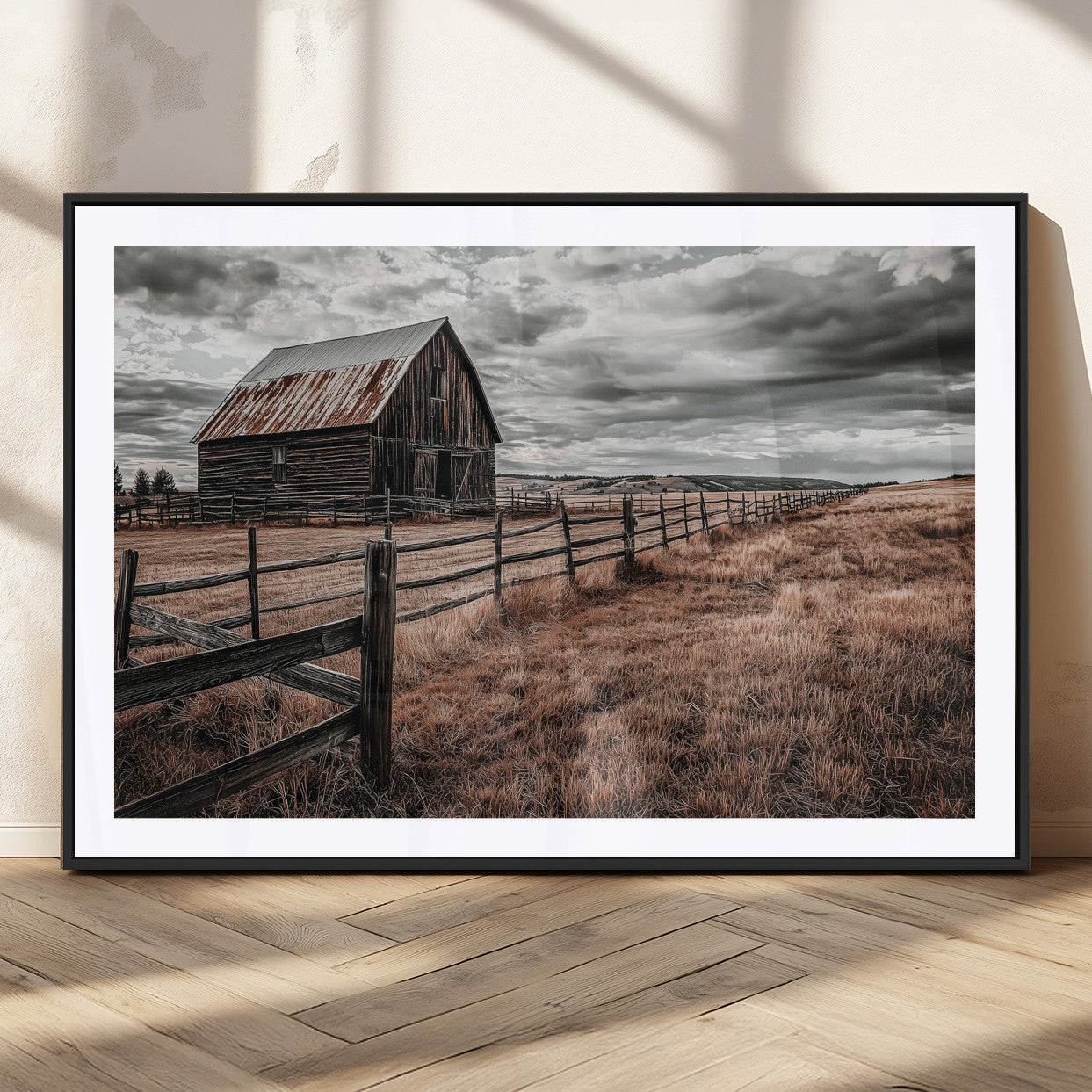 Framed canvas of a rustic barn under a moody sky with weathered fence and dark fields, ideal for farmhouse or rural-style wall decor.