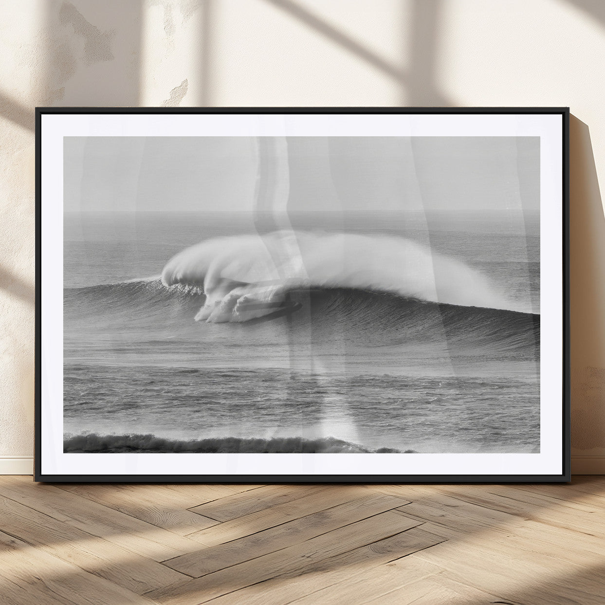 A dramatic black and white ocean wave crashing with immense force, capturing the raw power and movement of the sea in a bold seascape.