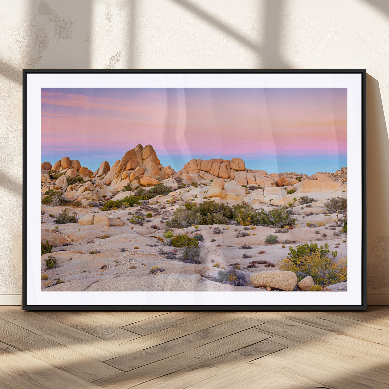 A breathtaking desert landscape featuring rugged rock formations under a vibrant pastel sunset sky, capturing the warmth and serenity of a Southwestern wilderness.