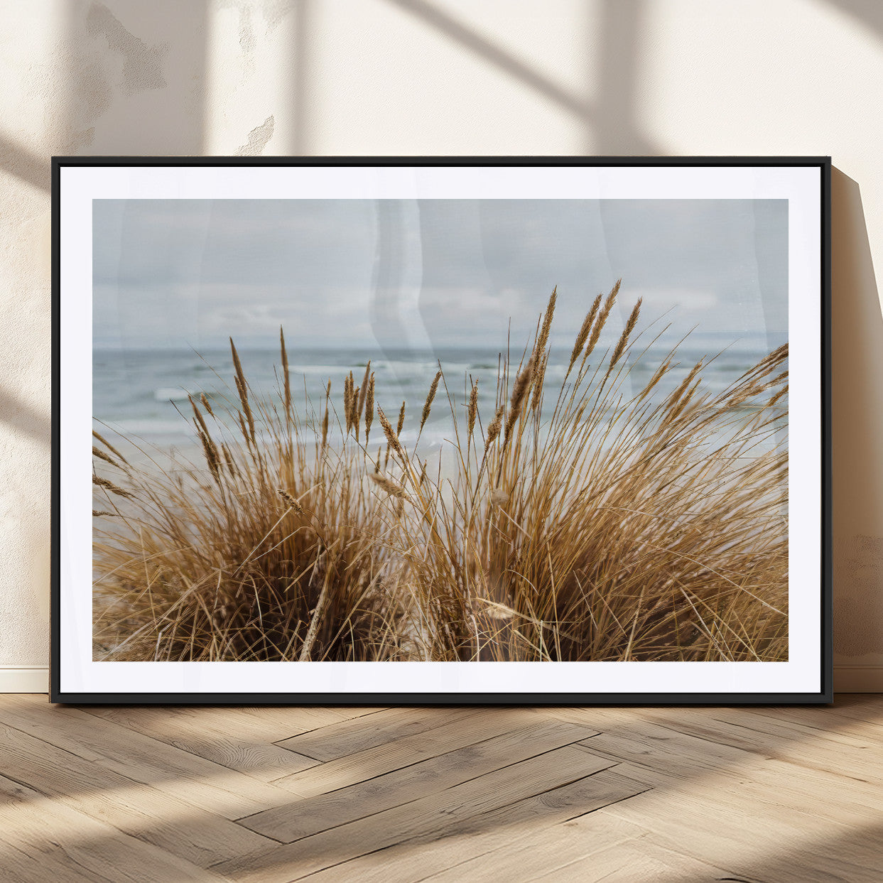 Canvas of golden beach grass swaying by the ocean under a soft cloudy sky, perfect for neutral-toned or coastal minimalist decor.