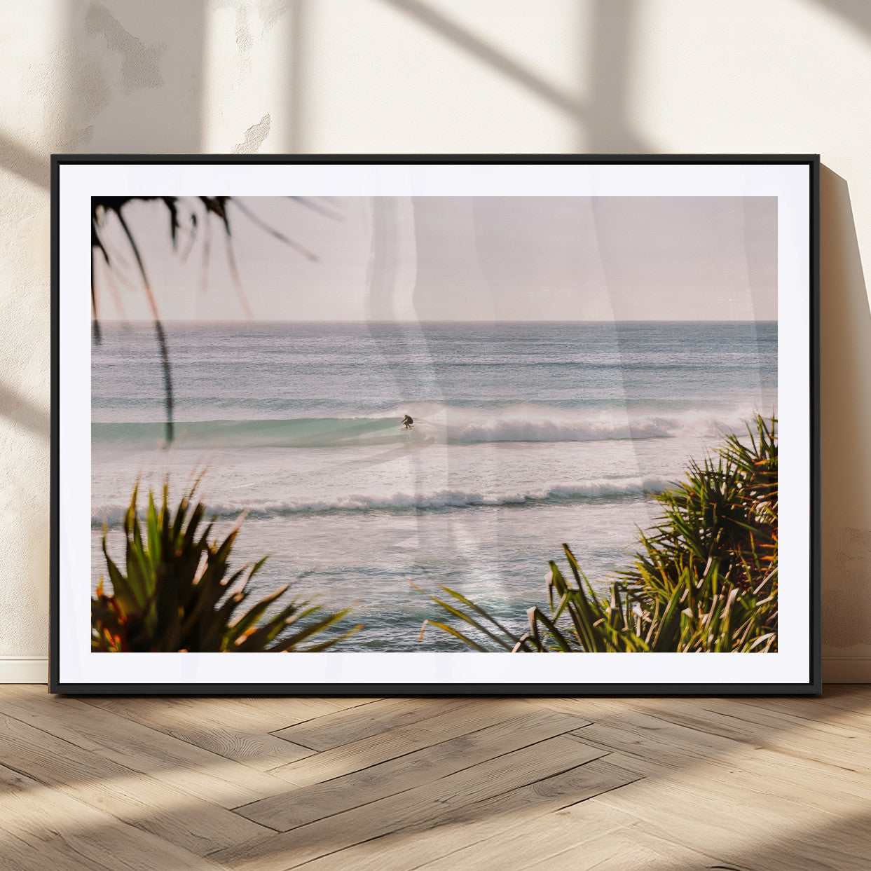 Canvas of a lone surfer riding a pastel wave at sunrise, perfect for tropical or coastal-themed spaces with a relaxed, airy vibe.
