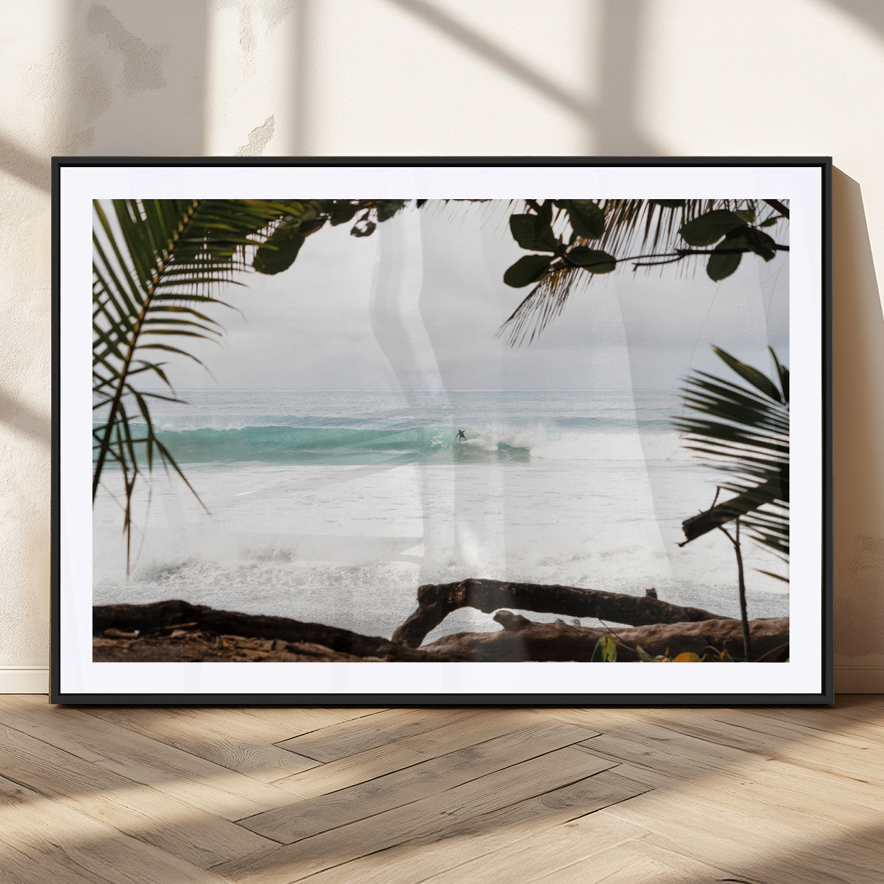 Tropical beach view with palm trees and surfer riding a wave, perfect for boho or coastal-inspired interior wall decor.