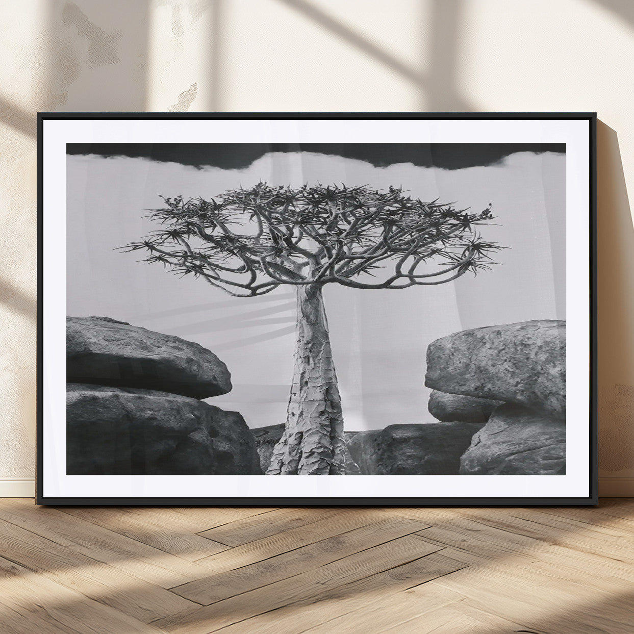 Black and white Joshua tree with bold rocky background, ideal for minimalist or desert-inspired home wall decoration.