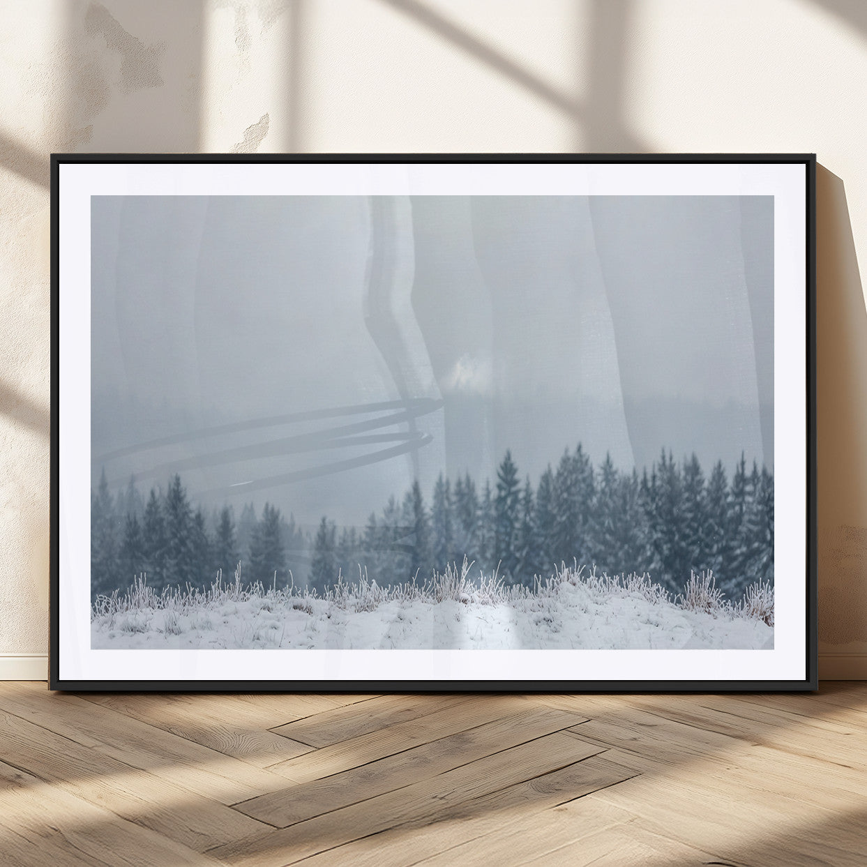 Snow-covered forest under misty sky, soft light breaking through clouds, ideal for minimalist or Nordic-inspired home decor.