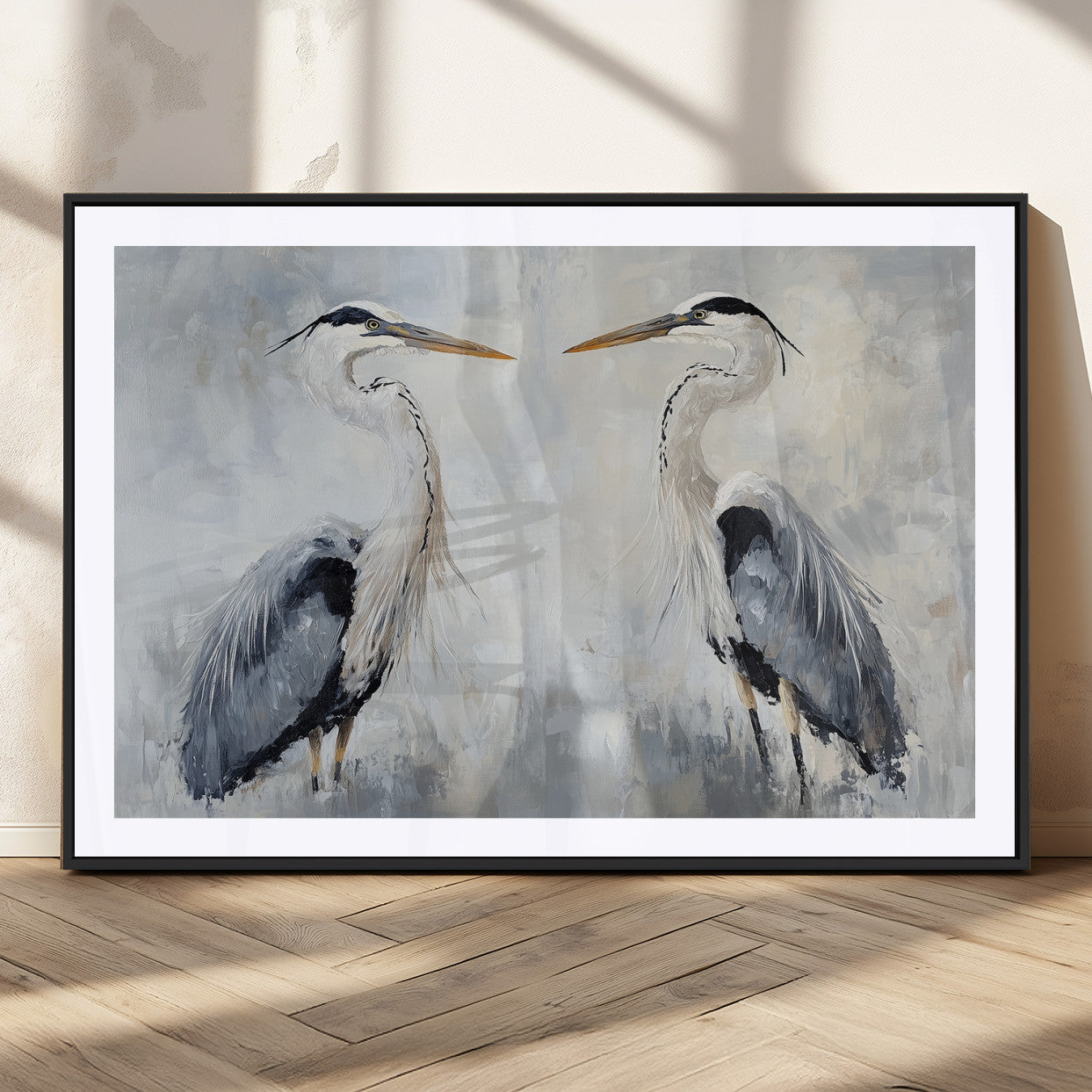 Two herons facing each other on a soft-toned background with blue-grey feathers, perfect for tranquil, coastal or nature-themed interiors.