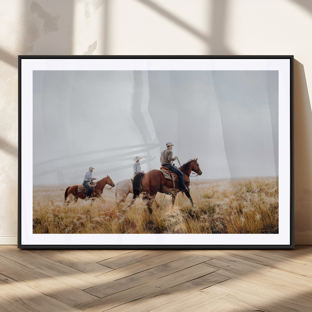 Three cowboys riding horses through a foggy prairie landscape, dressed in Western attire, evoking a rustic and adventurous Wild West aesthetic.