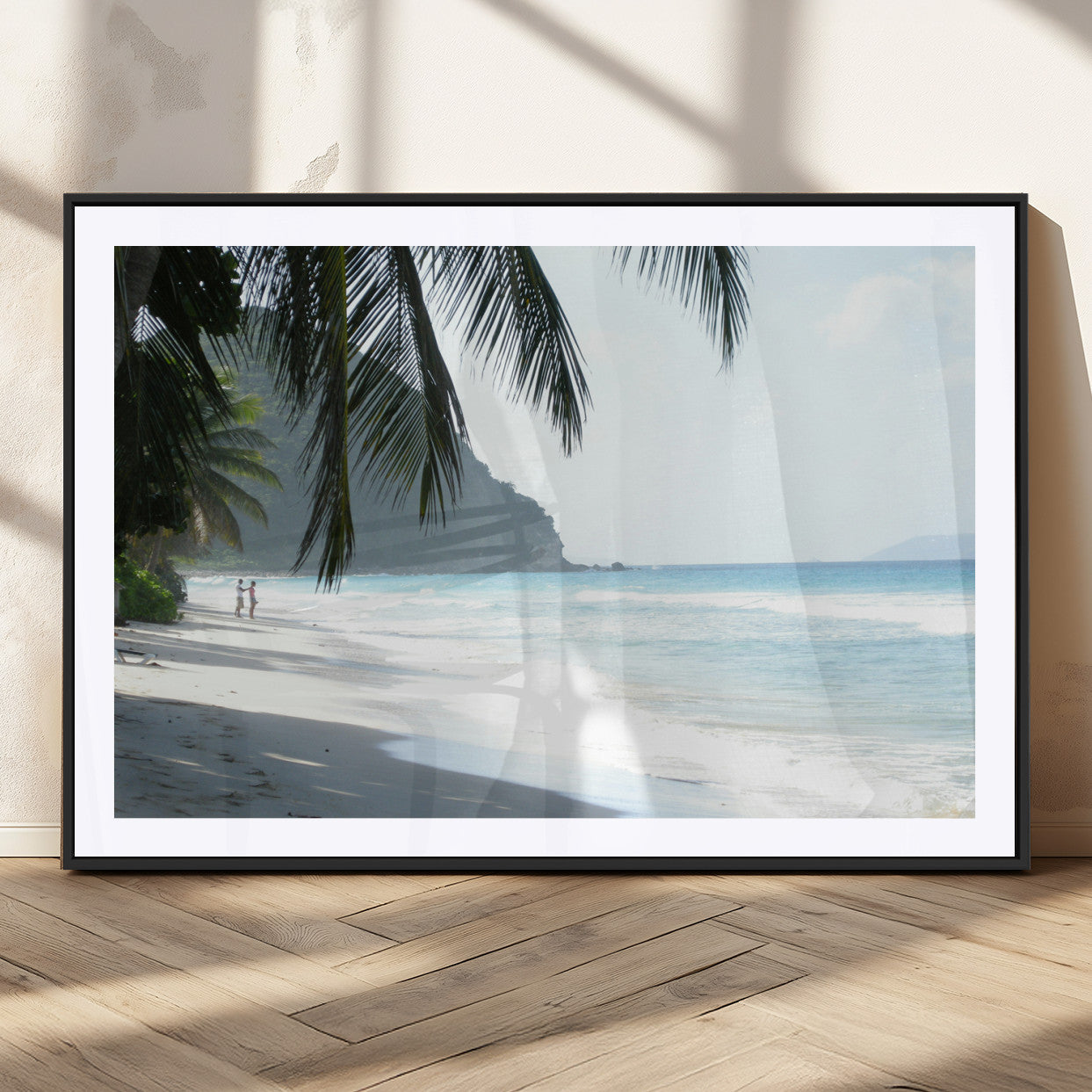 Tropical beach with palm tree shadows, white sand, and turquoise ocean waves, creating a serene and relaxing island escape atmosphere.