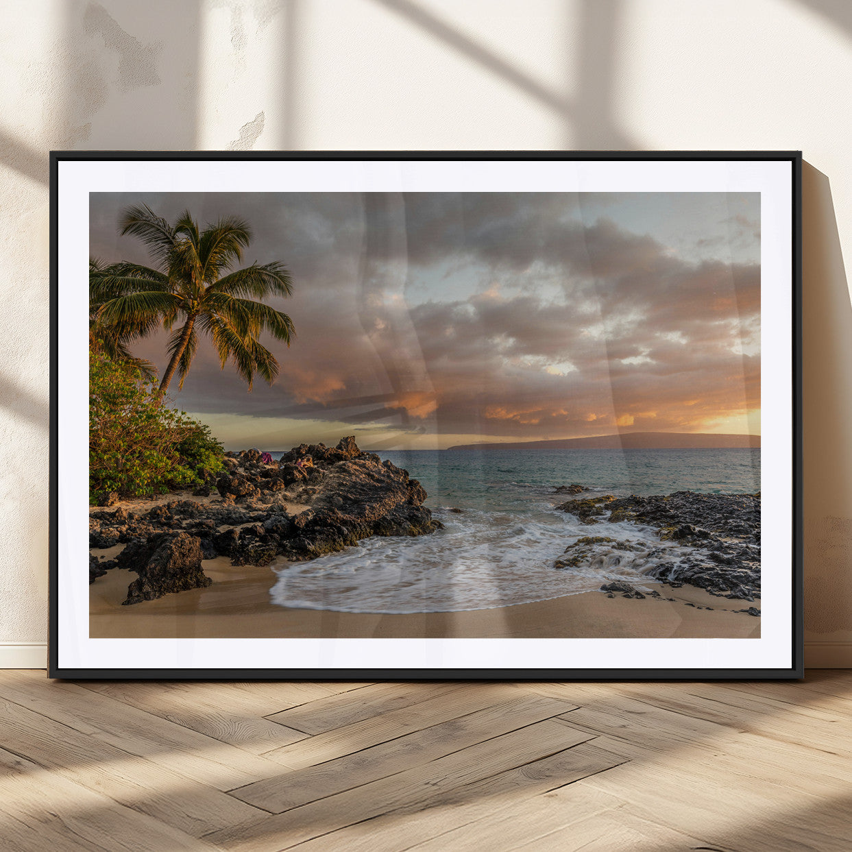 Golden sunset over a tropical beach with palm trees, rocky shoreline, and gentle ocean waves, perfect for coastal and island-inspired decor.