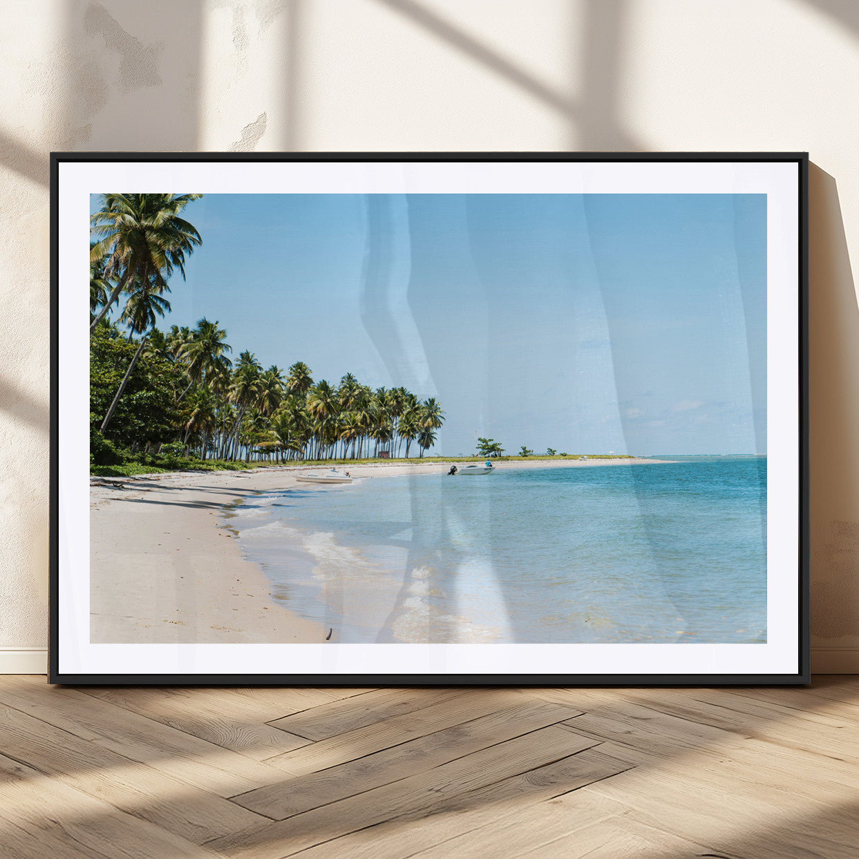 A serene tropical beach with clear blue water, soft sand, and lush palm trees under a bright sky, creating a peaceful island paradise atmosphere.