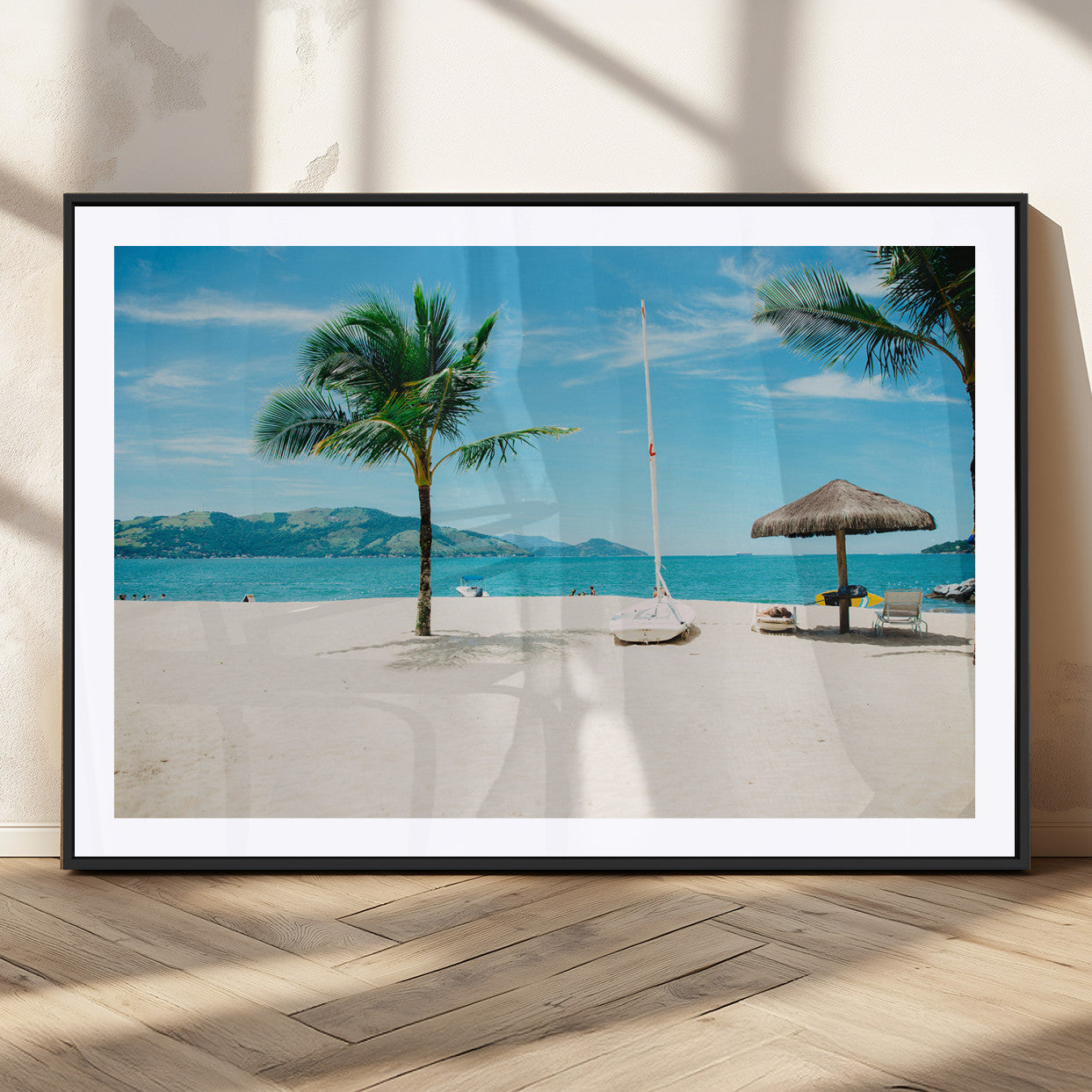 Tropical beach scene with palm trees, a white sailboat, and turquoise ocean waters under a bright blue sky, creating a peaceful summer vibe.