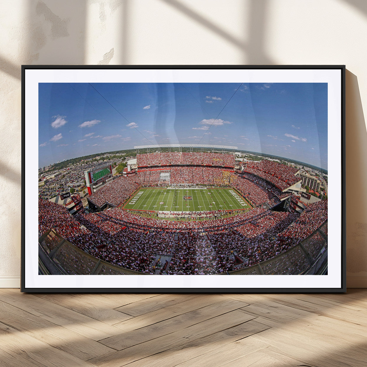 An William Brice-Stadium view of a full football stadium with cheering fans and clear blue skies, capturing the excitement and energy of the game.
