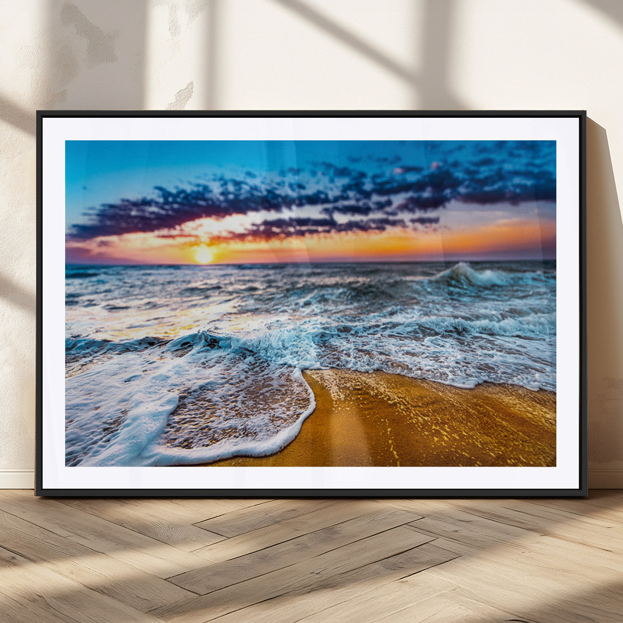 Beautiful ocean shoreline at sunset with foamy waves washing onto golden sand under a colorful sky – Wall Art Canvas Print.