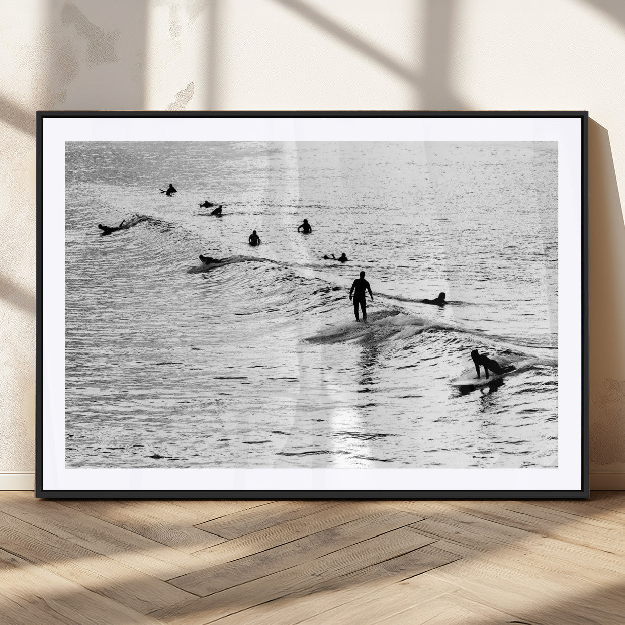19970637-MGV-CV-36X24-Black and white artistic view of surfers riding and paddling on waves in the ocean, capturing the dynamic motion and energy of surfing