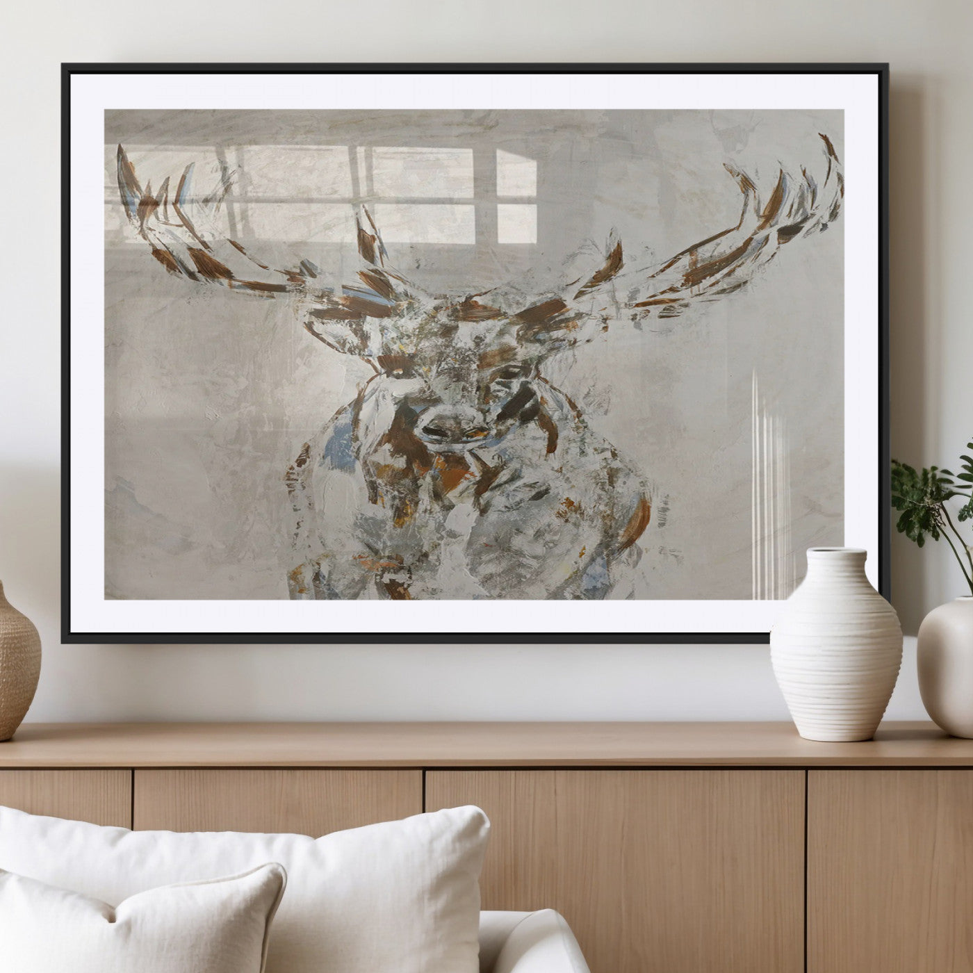 Abstract painting of a deer with antlers in neutral earth tones, ideal for modern rustic or lodge-style living room wall decor.