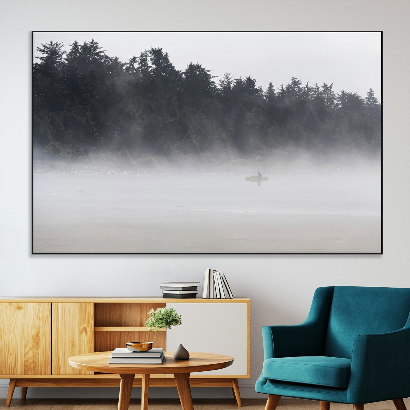 A lone surfer carrying a board through a misty shoreline, surrounded by dense trees and fog, creating a peaceful and mysterious coastal scene.