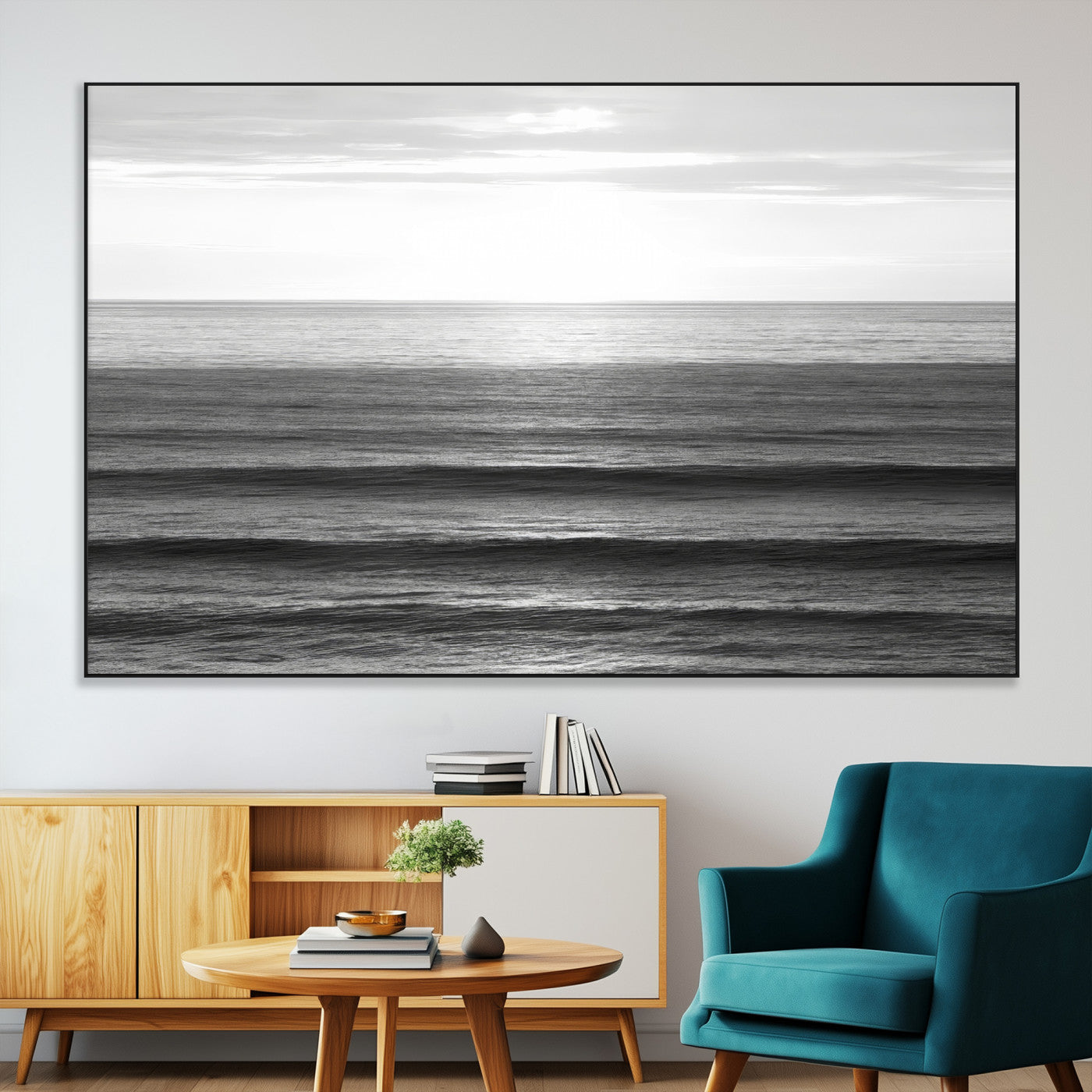 Minimalist black and white ocean view with layered waves reflecting sunlight, evoking a sense of calm and coastal serenity.