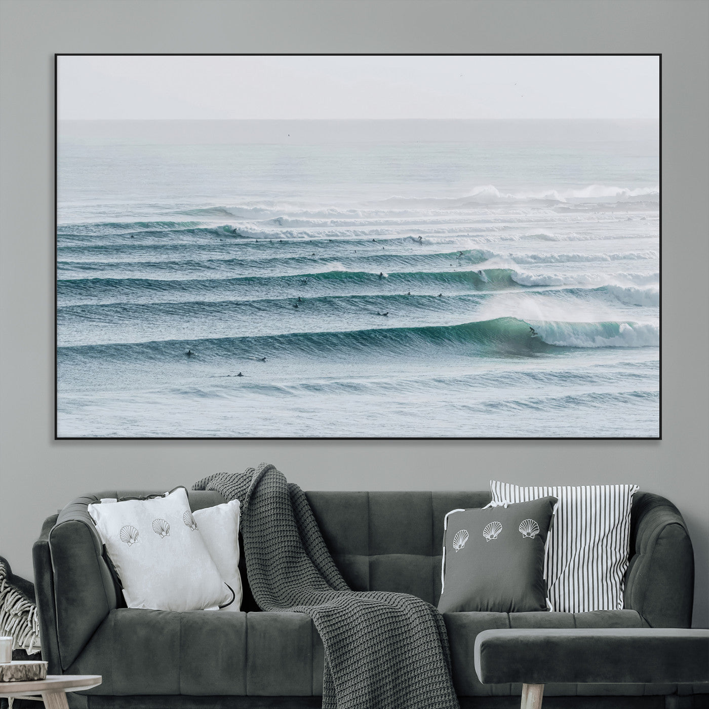High-angle view of surfers lining up across layered ocean waves, ideal for minimal coastal or surf-inspired room decor.