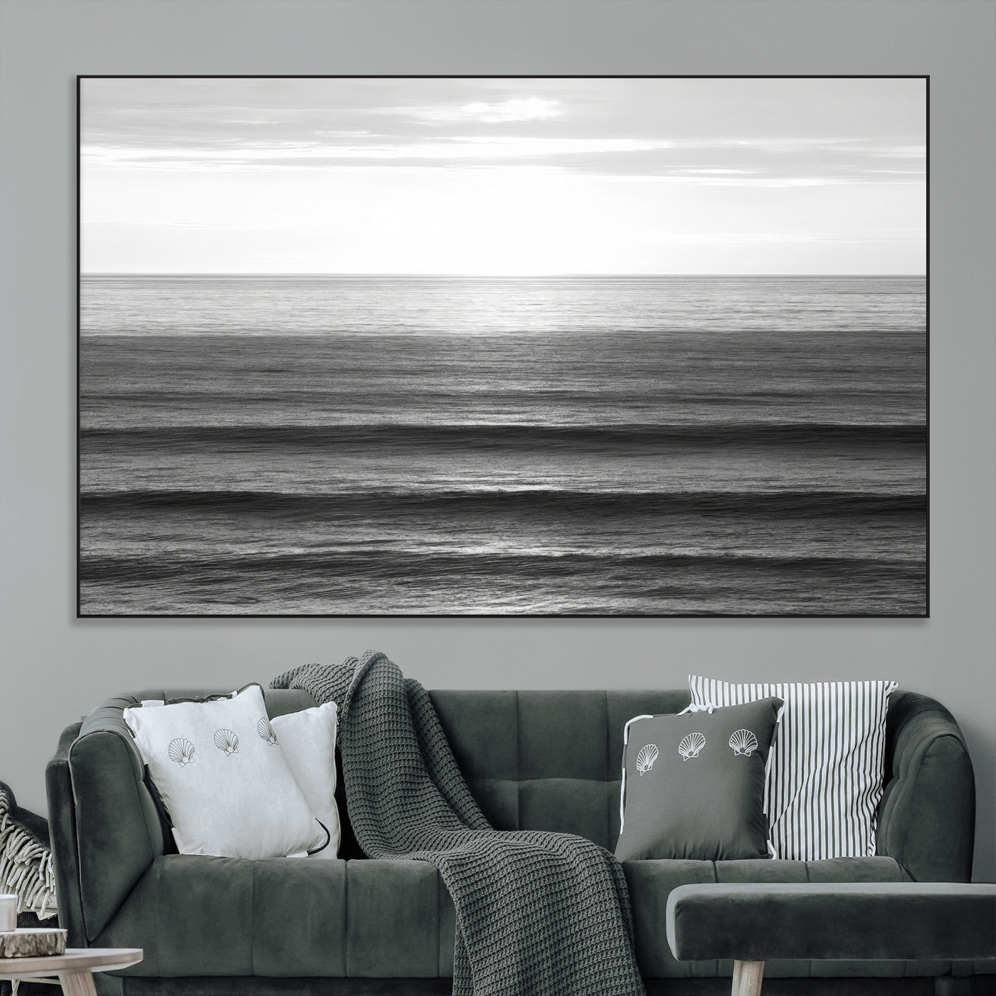 Minimalist black and white ocean view with layered waves reflecting sunlight, evoking a sense of calm and coastal serenity.