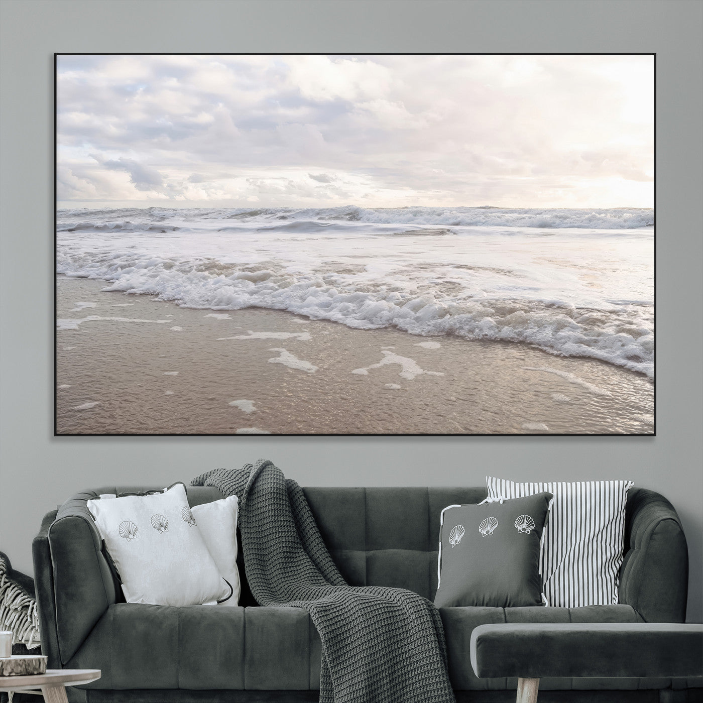 Peaceful ocean waves rolling onto the sandy shore under soft light, perfect for neutral or coastal minimalist decor themes.