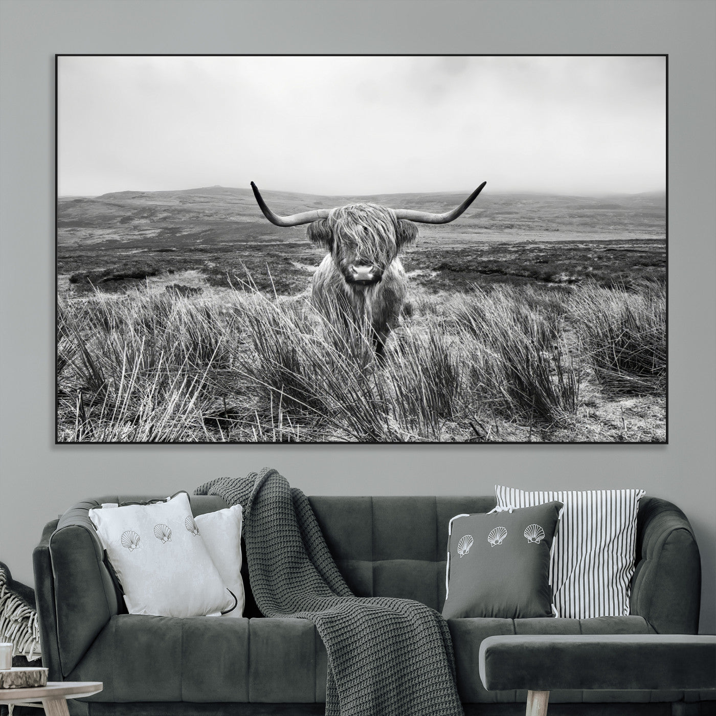 A black and white portrait of a Highland cow in a foggy Scottish countryside, capturing a rustic aesthetic and tranquil farm escape.