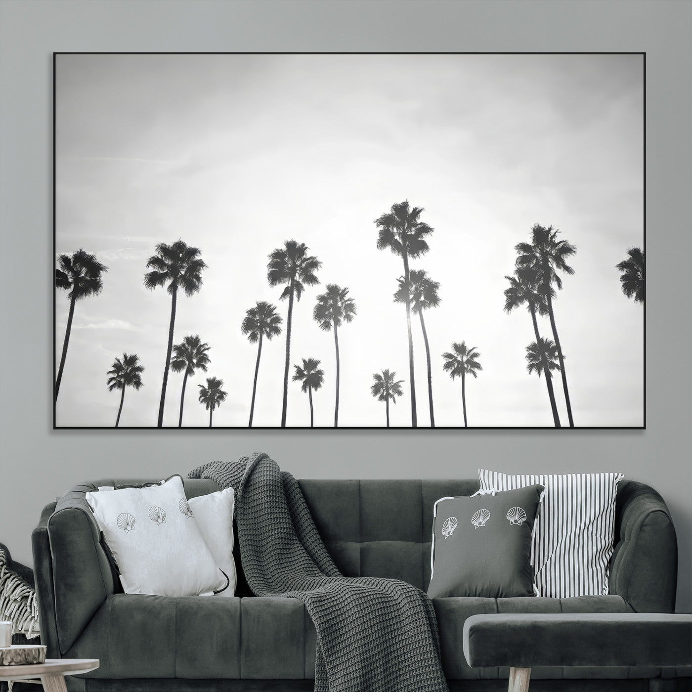 A black and white minimalist scene featuring tall palm trees silhouetted against a bright sky, creating a dreamy and timeless tropical aesthetic.