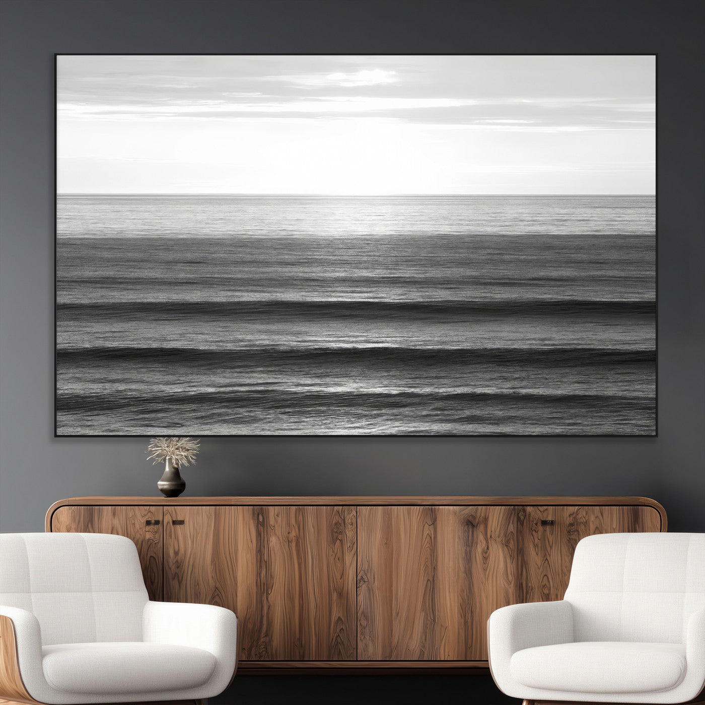 Minimalist black and white ocean view with layered waves reflecting sunlight, evoking a sense of calm and coastal serenity.