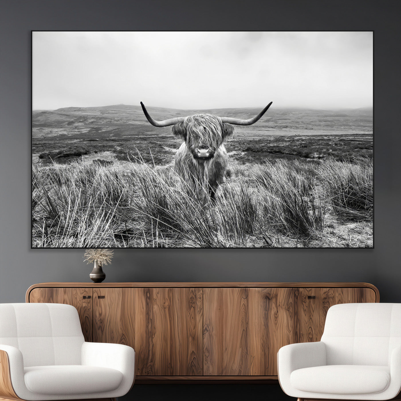 A black and white portrait of a Highland cow in a foggy Scottish countryside, capturing a rustic aesthetic and tranquil farm escape.