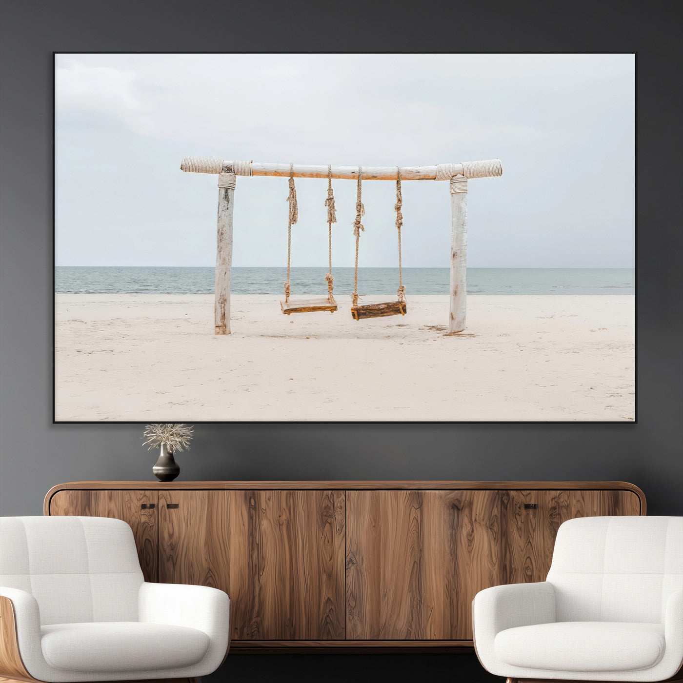 A rustic wooden beach swing stands on a serene sandy shore with an ocean horizon in the background, creating a tranquil and dreamy coastal escape.