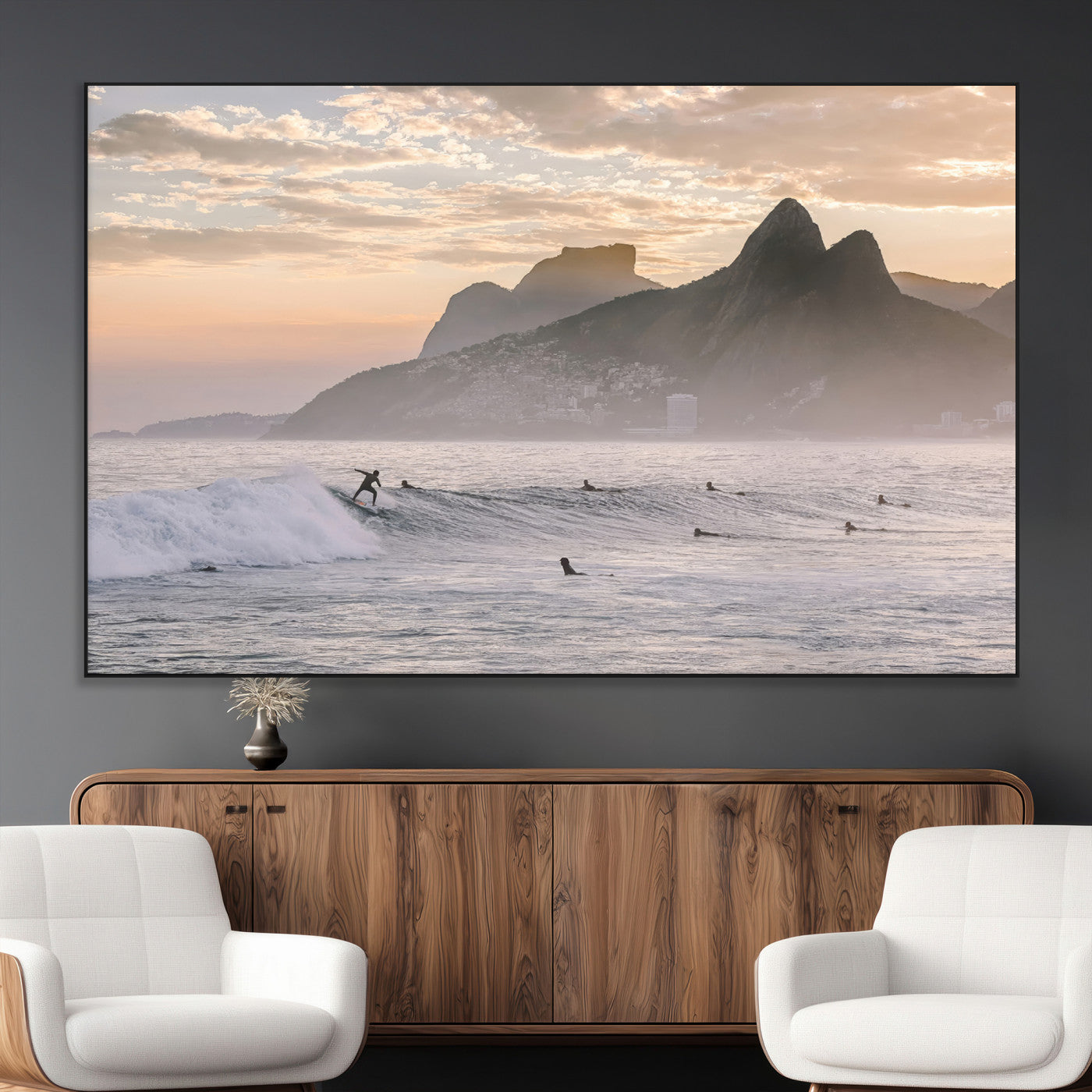 A surfer rides a golden hour wave near misty coastal mountains, surrounded by fellow surfers, capturing the spirit of a coastal adventure.