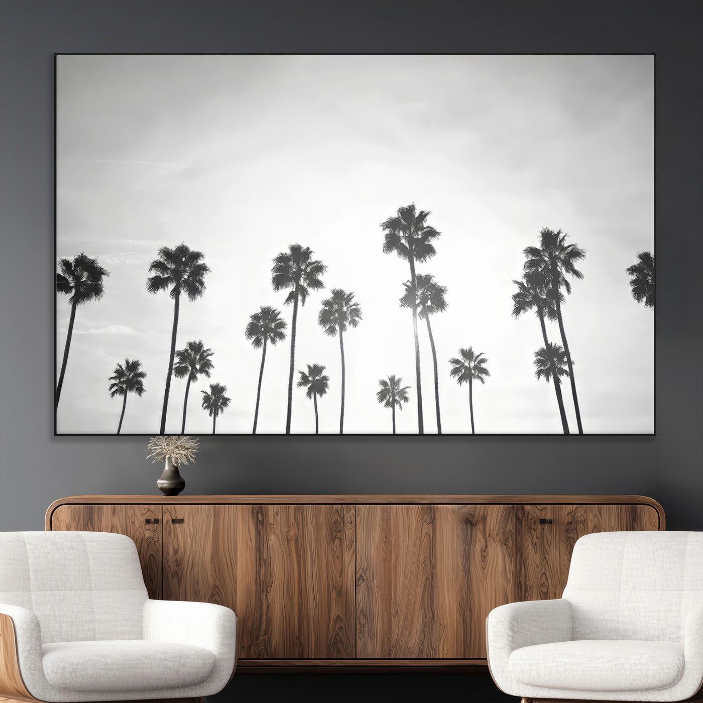 A black and white minimalist scene featuring tall palm trees silhouetted against a bright sky, creating a dreamy and timeless tropical aesthetic.