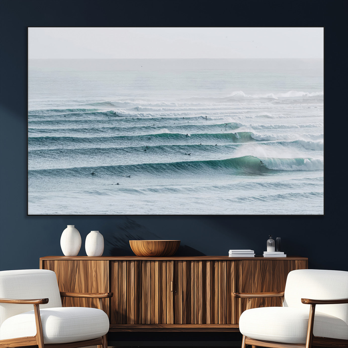 High-angle view of surfers lining up across layered ocean waves, ideal for minimal coastal or surf-inspired room decor.