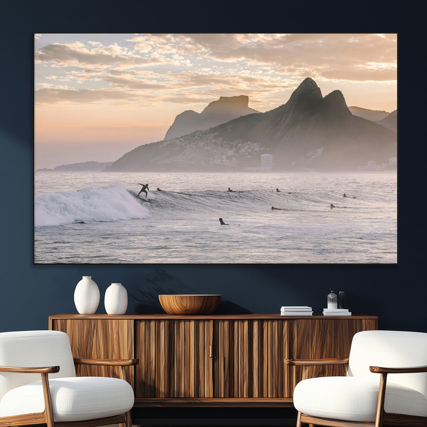 A surfer rides a golden hour wave near misty coastal mountains, surrounded by fellow surfers, capturing the spirit of a coastal adventure.