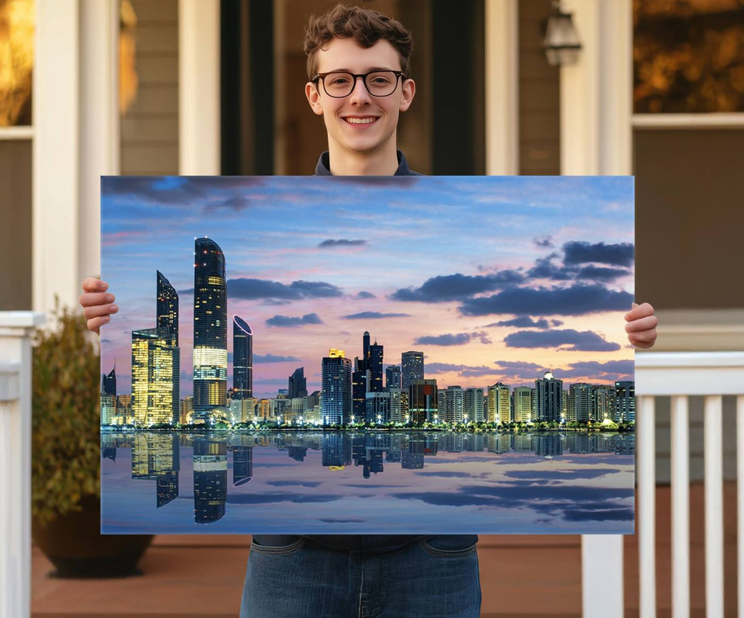 A gallery-quality wall art canvas print captures the Dubai city skyline with skyscrapers reflected in water at sunset.