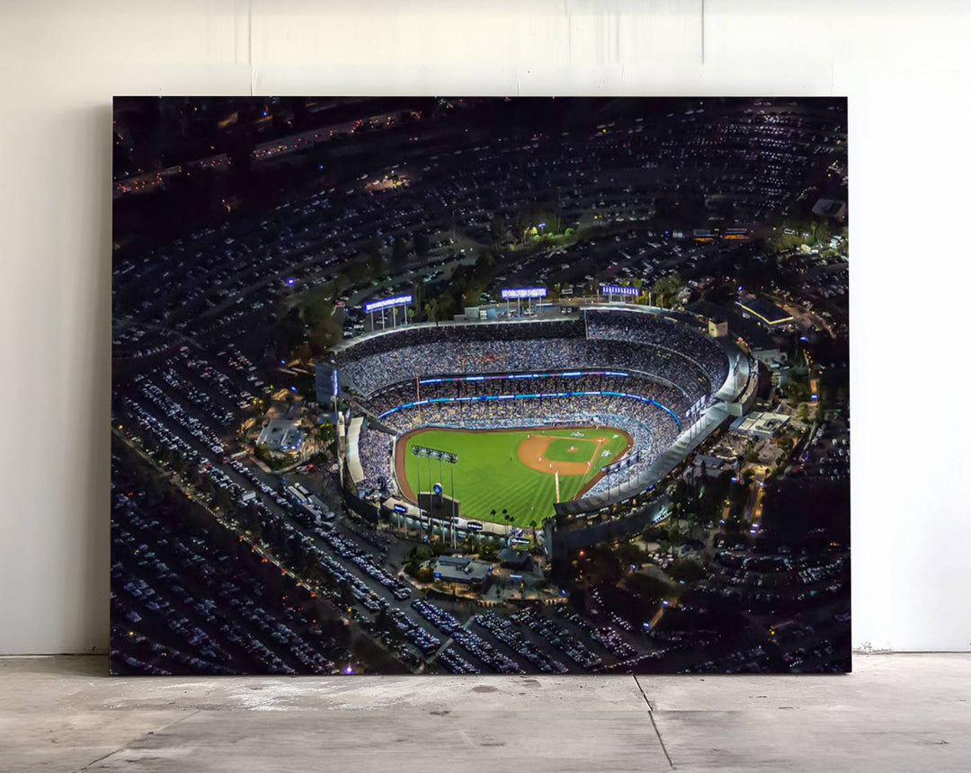 A large Los Angeles Dodgers print of Dodger Stadium at night is displayed near a window.