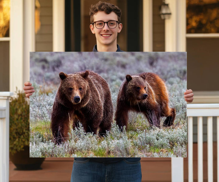 The "Grizzly 399 in Wild Flowers" wall art canvas print, showcasing grizzly bears amidst vibrant wildflowers, elegantly captures the enchanting essence of nature. This handmade piece from the USA brings striking beauty to any space.