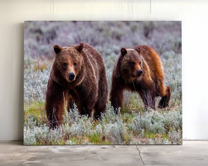 The "Queen of the Tetons" is a stunning canvas art print featuring Grizzly 399 and two bears strolling through a grassy field. Its gallery-quality finish beautifully captures the essence of nature, making it perfect for rustic home decor.