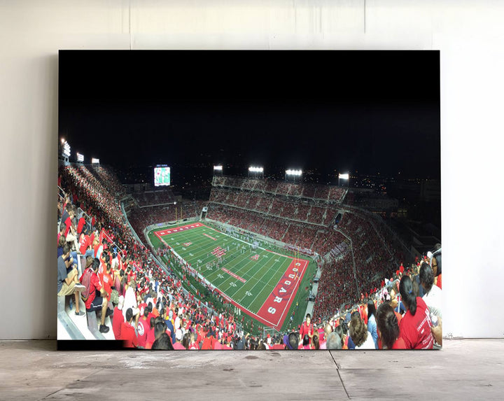 The wall art canvas print features a scene from a packed TDECU Stadium at night, highlighting the field and scoreboard.