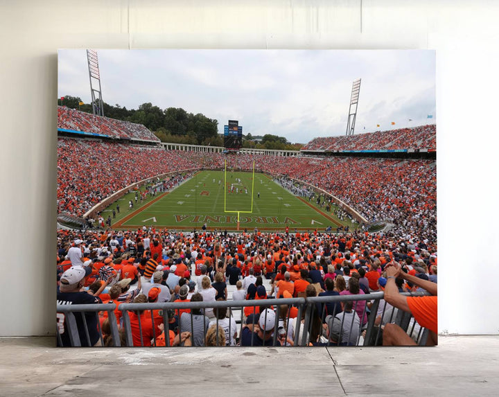 The Virginia Cavaliers Wall Art Canvas Print features a thrilling game at Scott Stadium surrounded by greenery.