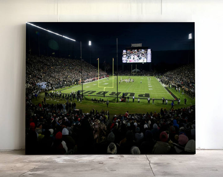 A Purdue Boilermakers canvas print beautifully showcases Ross–Ade Stadium in West Lafayette, vibrant with fans and a large screen display.