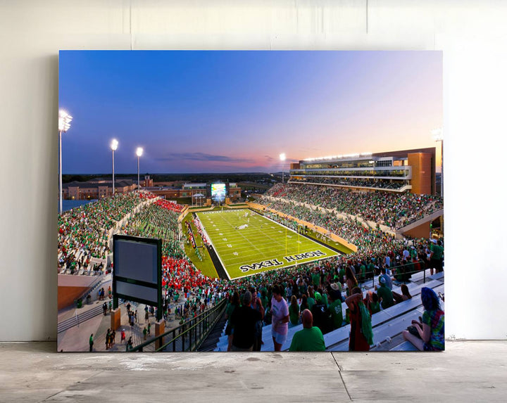 The canvas features Denton DATCU Stadium, OZEKI FIELD, illuminated under the lights and vibrant with fans supporting the University of North Texas.