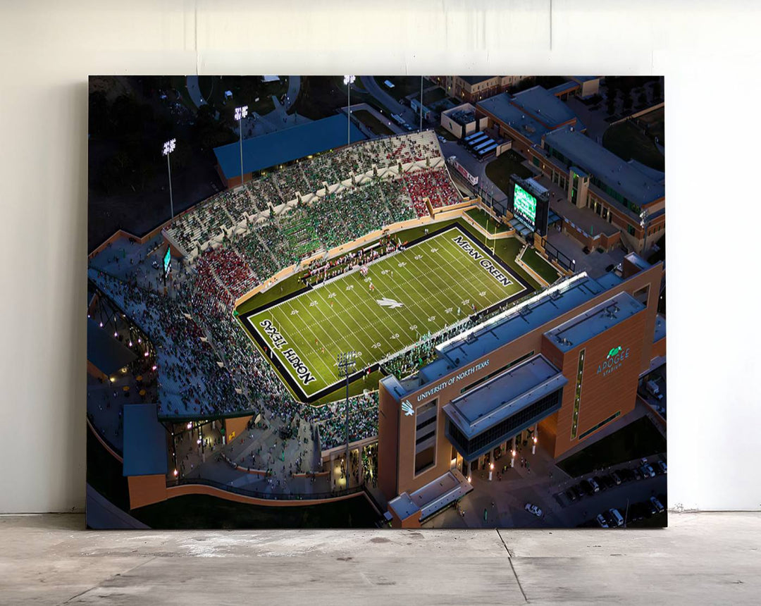 Night aerial view of fans at UNT Mean Green game captured on premium DATCU Stadium canvas wall art print.