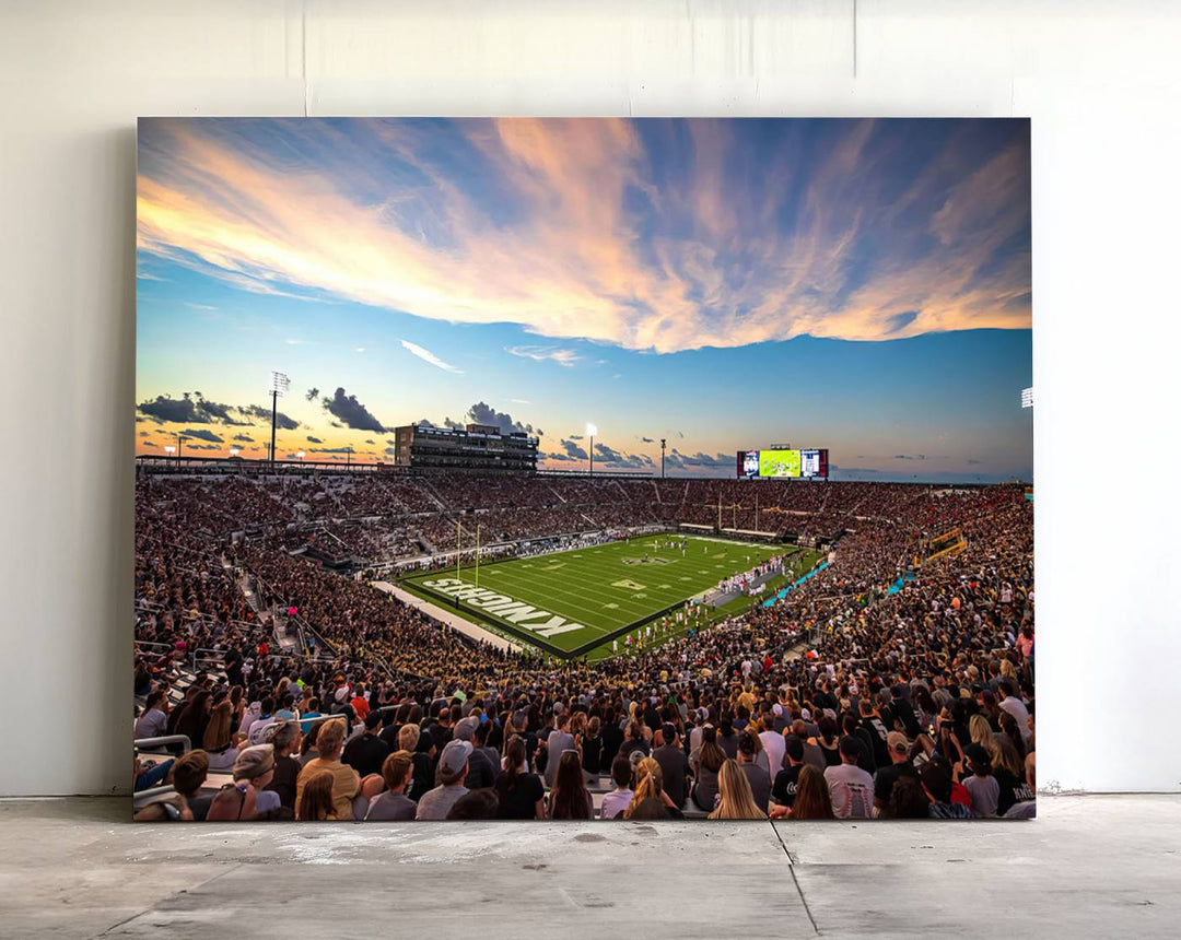 A vibrant wall art canvas captures a sunset scene at Orlandos FBC Mortgage Stadium, featuring the UCF Knights.