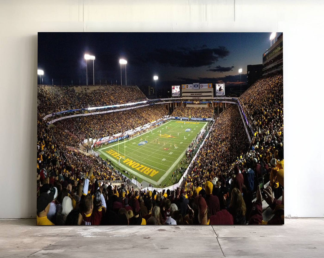 A room featuring an ASU Sun Devils Football Team Print, capturing fans at Phoenix Mountain America Stadium at dusk.