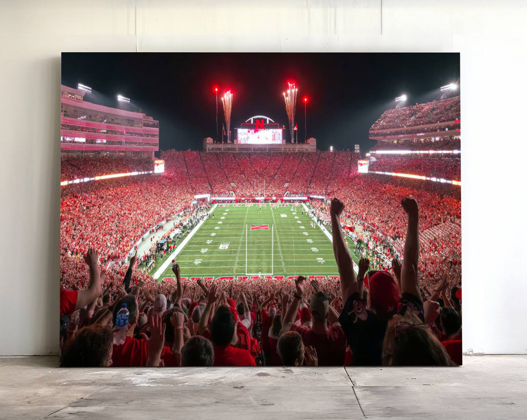 A vibrant canvas print of the Lincoln Memorial Stadium at night with fireworks, featuring the University of Nebraska Cornhuskers Football.